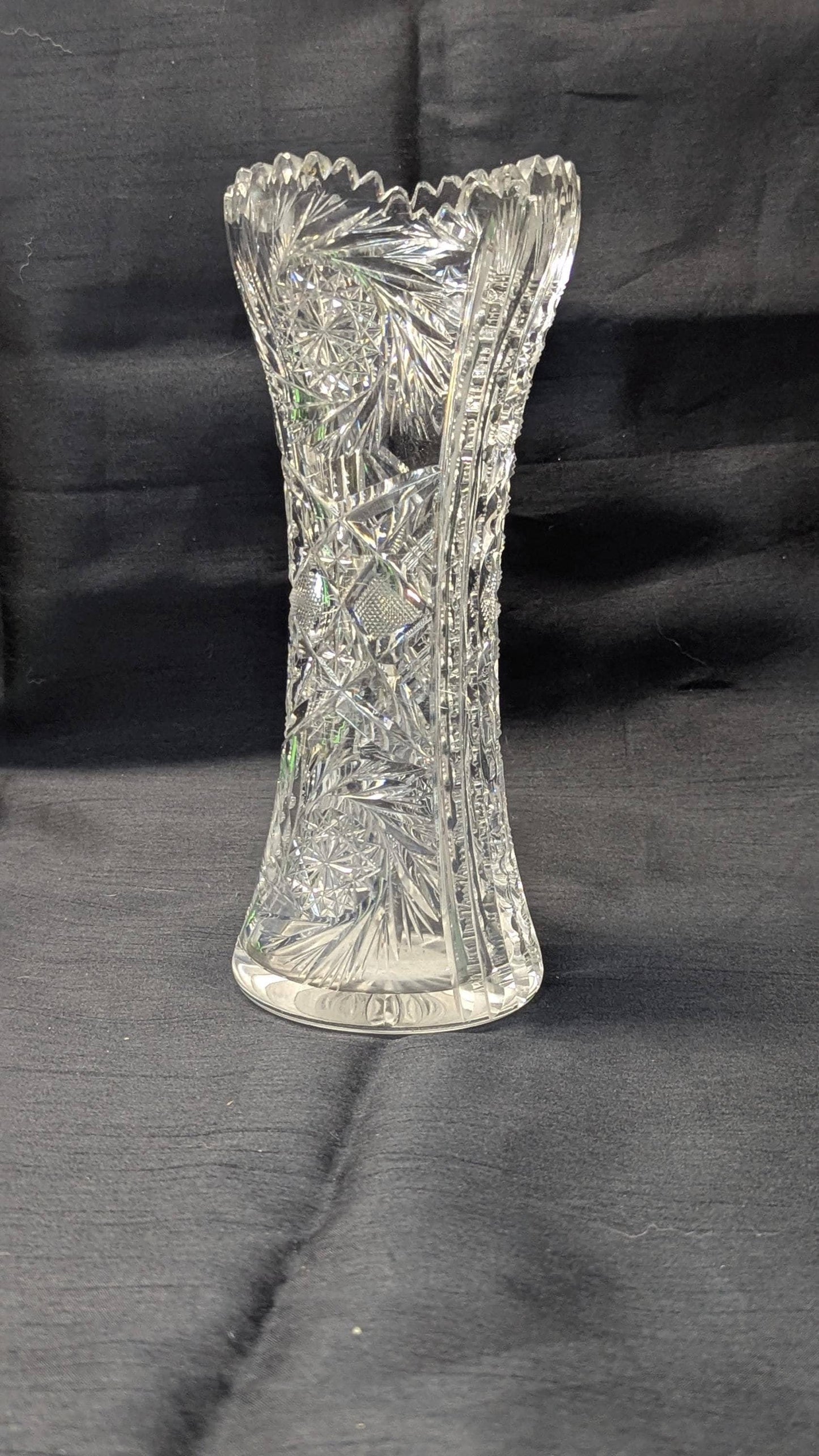 Clear bohemian crystal vase, has some chips on top